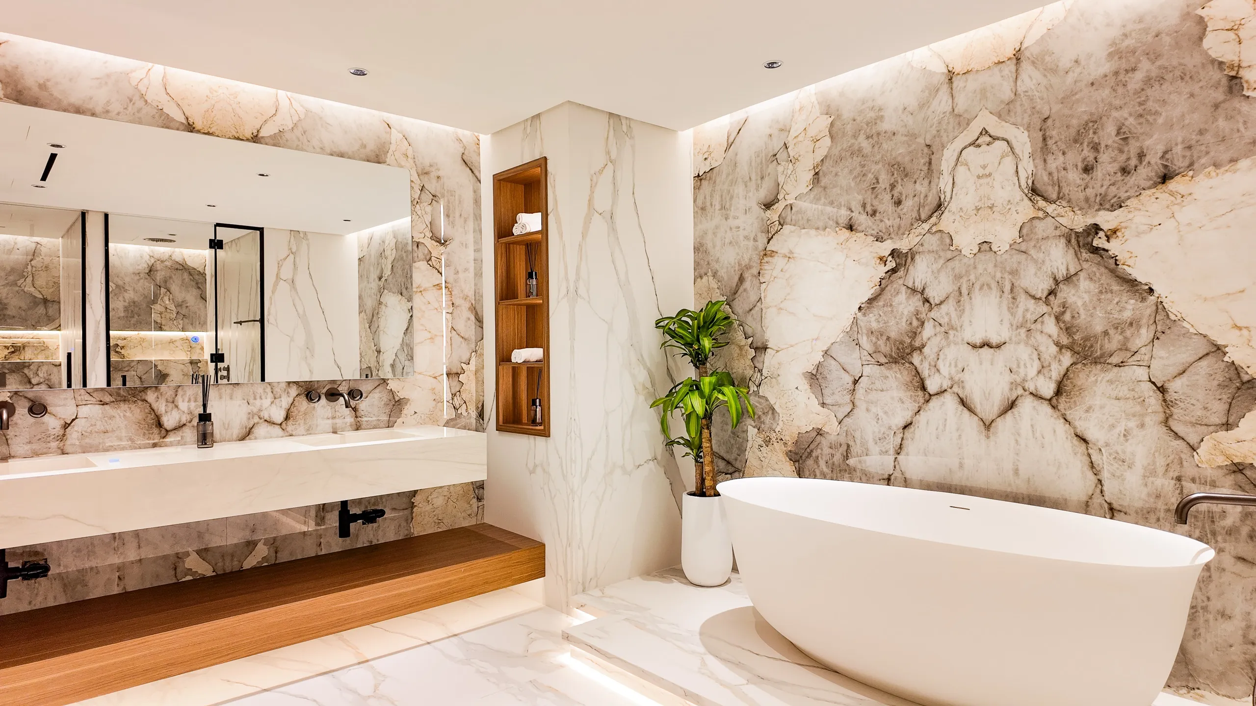 Bathroom finished in stone, lit for the evening