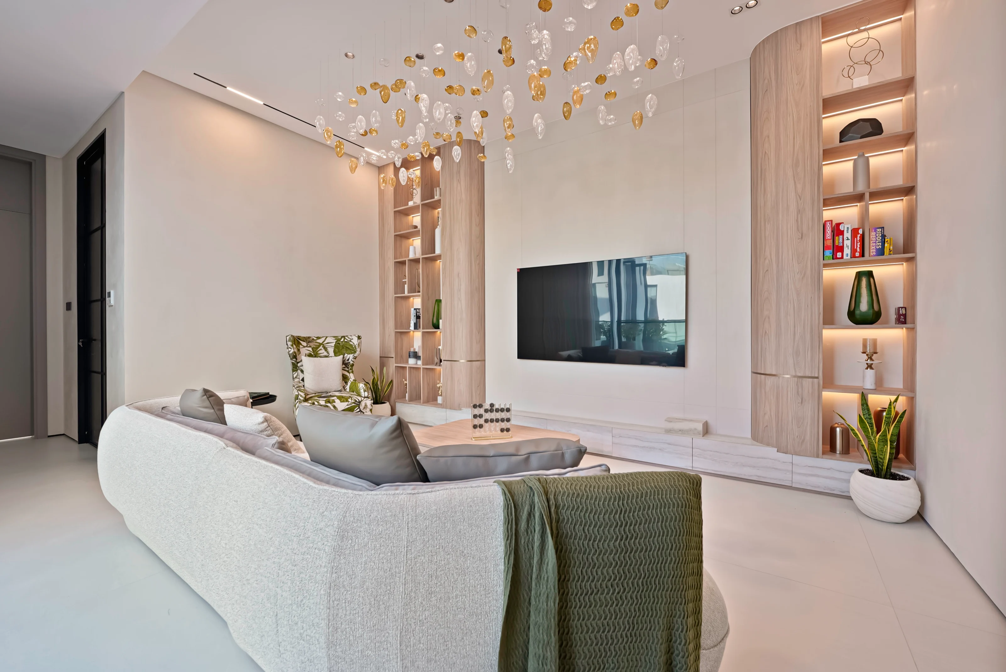 Lounge with a book-matched marble feature panel and curved seating