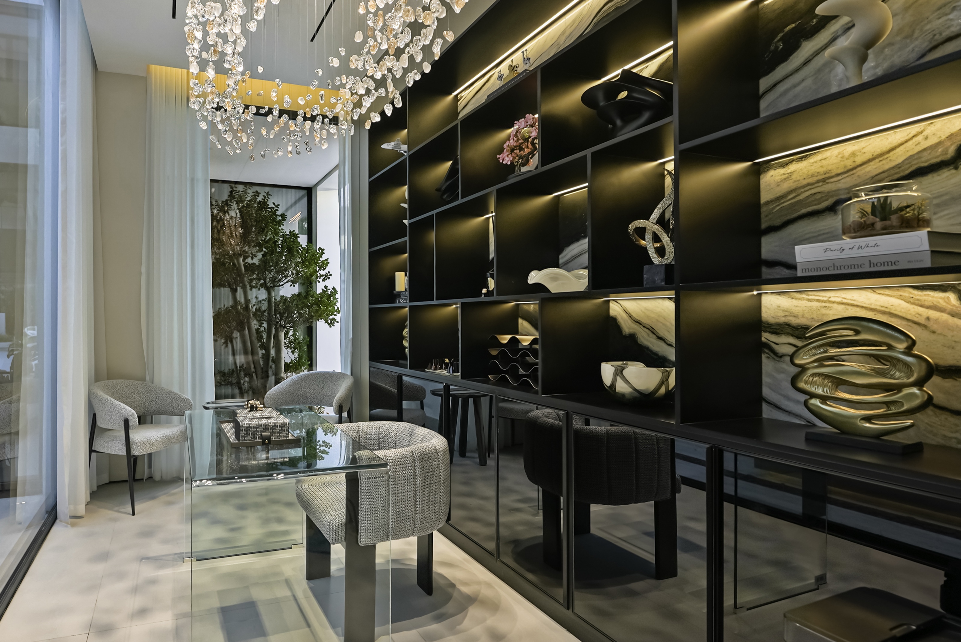Styled study with illuminated marble-backed shelving, Al Barari villa