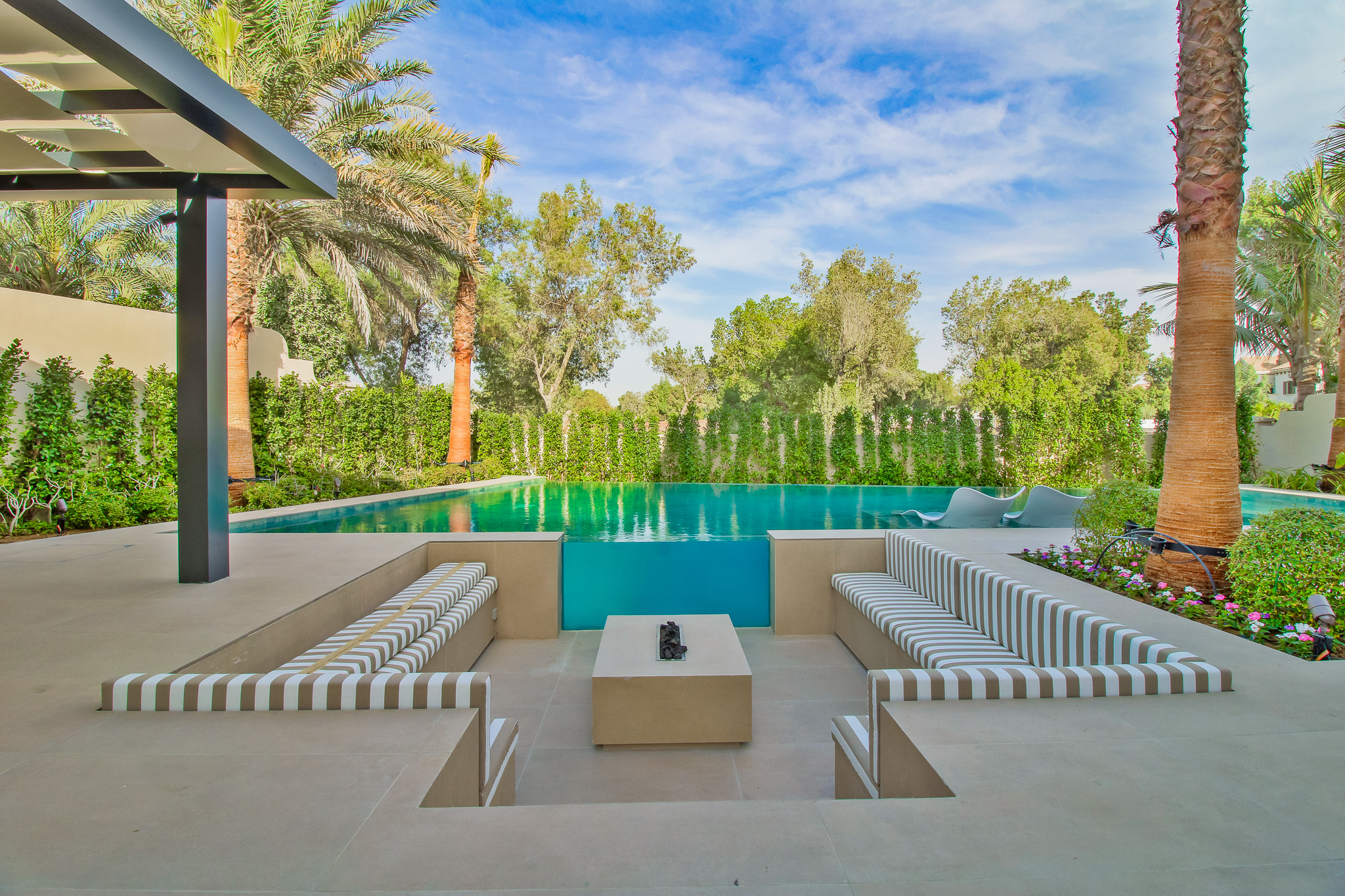 Infinity pool with sunken fireside seating, Jumeirah Golf Estates villa